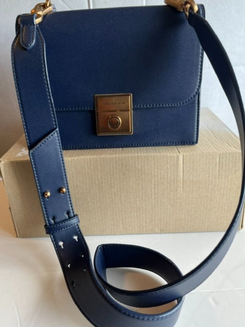Charles & Keith PU leather crossbody bag.